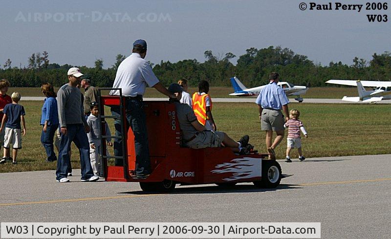Wilson Industrial Air Center Airport (W03) - One of AirCare's movers, complete with flames