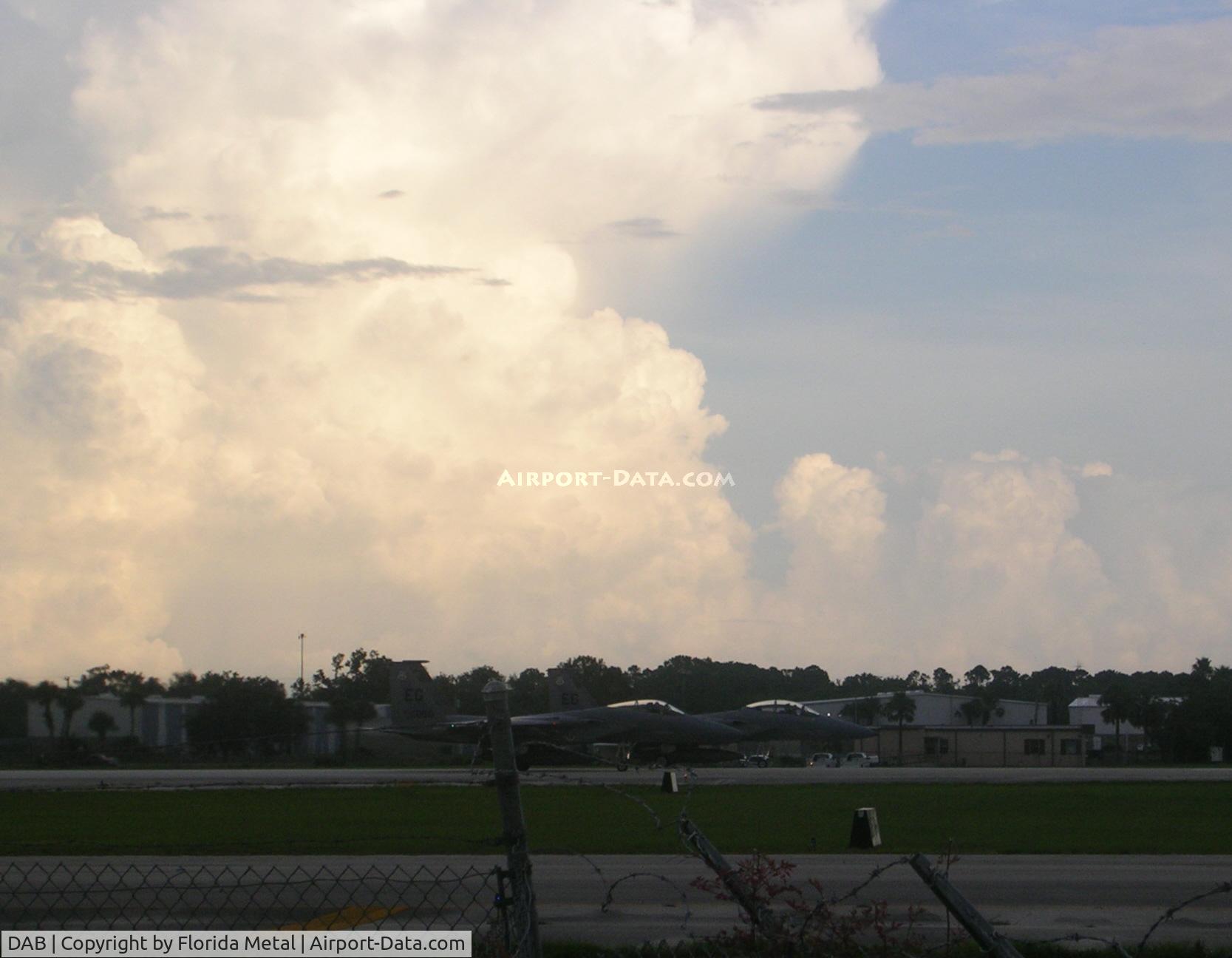 Daytona Beach International Airport (DAB) - F-15s line up with towering storm clouds in background