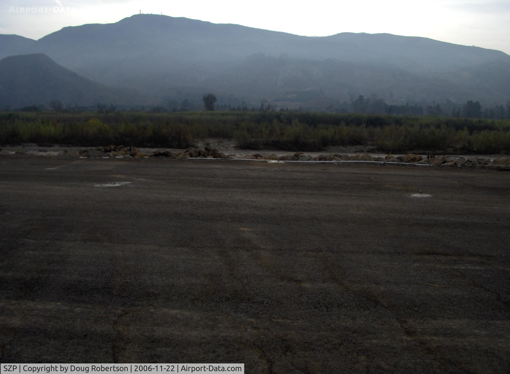 Santa Paula Airport (SZP) - New transient parking tiedown pads anchored in concrete, 3 per airplane-Santa Clara River bed over the bank