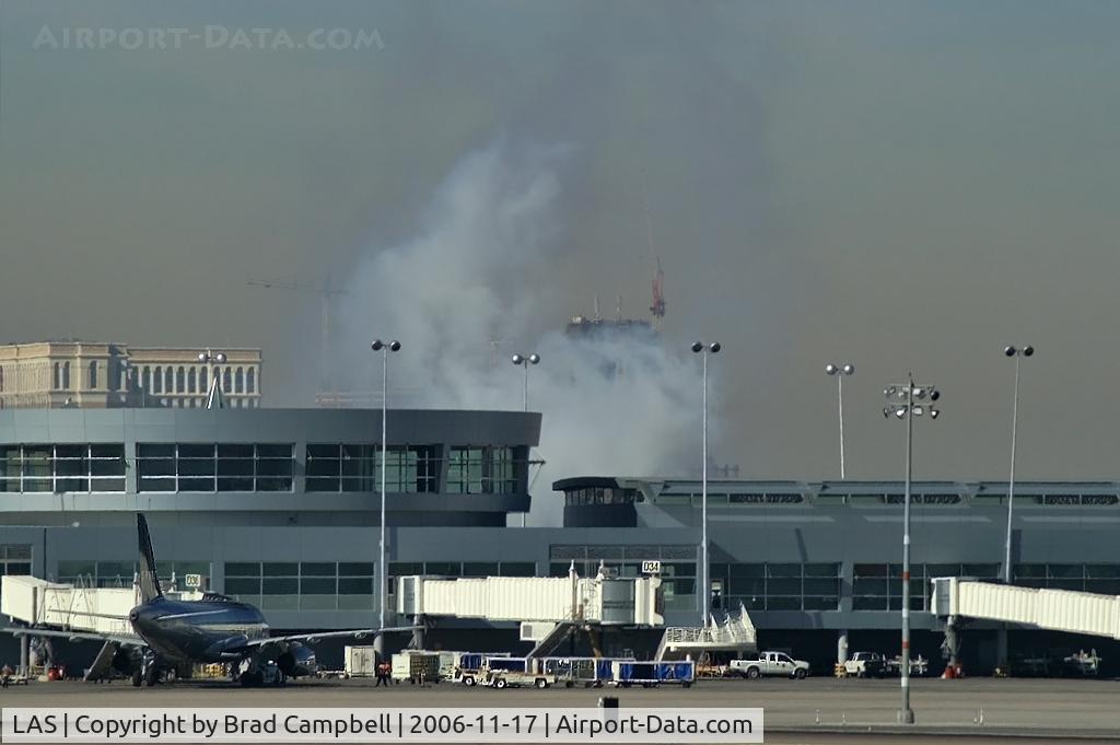 Harry Reid International Airport (LAS) - A better shot of the smoke coming from behind the 'D' Gates Terminal.