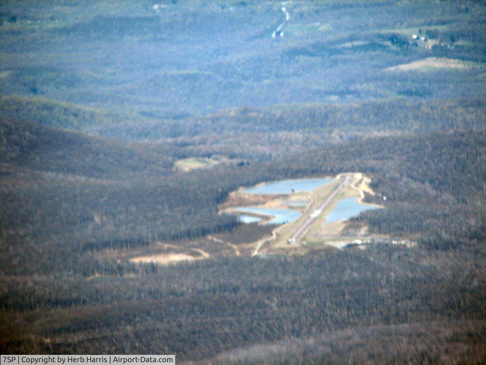 7SP Airport - Settled in the mountains as seen from approaching from the east