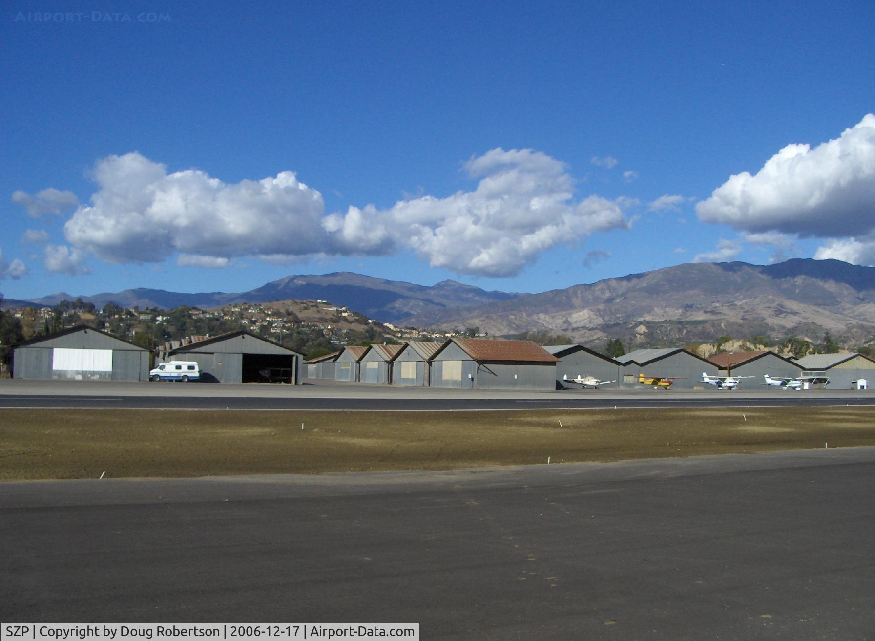 Santa Paula Airport (SZP) - Old Hangars, Topa Topa Mountains, Santa Paula Ridge, Santa Paula Peak in background. Elevations:  Topa Topa Mts. 6,244 ft & 6,704 ft. Ridge 2,817 ft. Peak 4,917 ft.