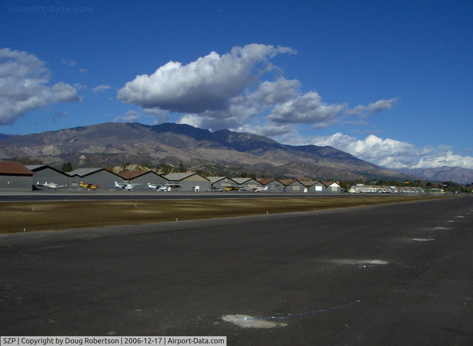 Santa Paula Airport (SZP) - Old Hangars, Santa Paula Peak in background. Elevation 4.917 ft.
