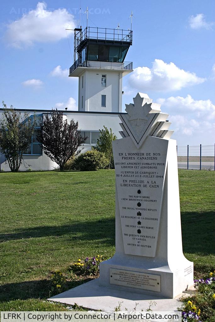 Caen Carpiquet Airport, Caen France (LFRK) - The tower of Caen with in front the statue to remember the Canadian soldiers who liberated the airport in 1944