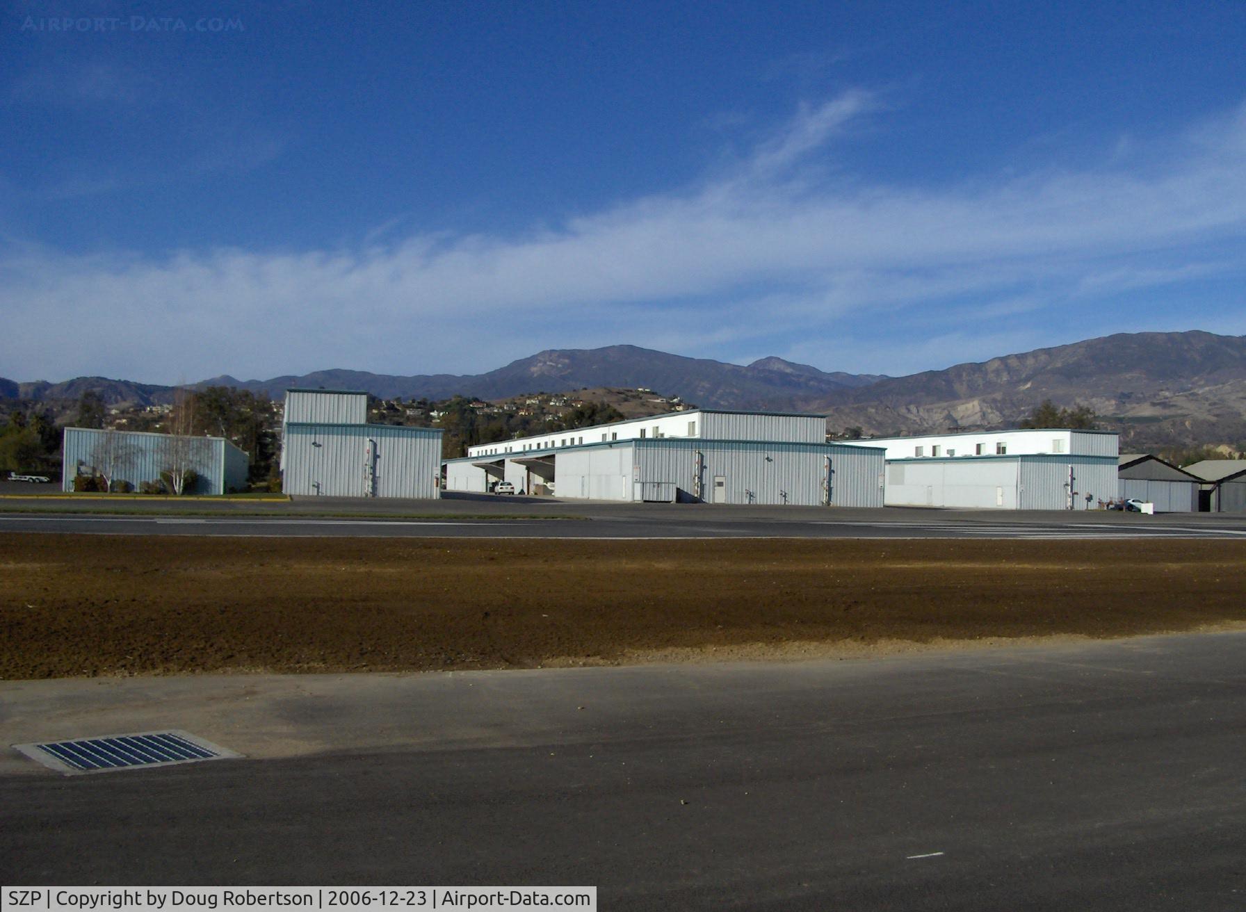 Santa Paula Airport (SZP) - Newer Hangars, Topa Topa Mnts. in background-6,244 feet, Hines Peak 6,704 feet elevation, nearer to right-Santa Paula Ridge 2,817 feet elevation