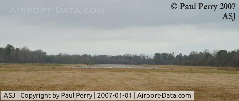 Tri-county Airport (ASJ) - Ground level view down Runway 01