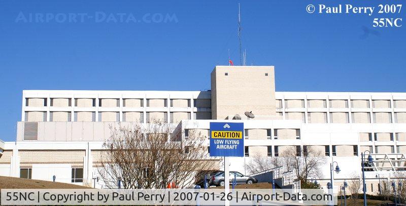 Lenoir Memorial Hospital Heliport (55NC) - The roof mounted windsock, and one of the warning signs at Lenoir Hospital