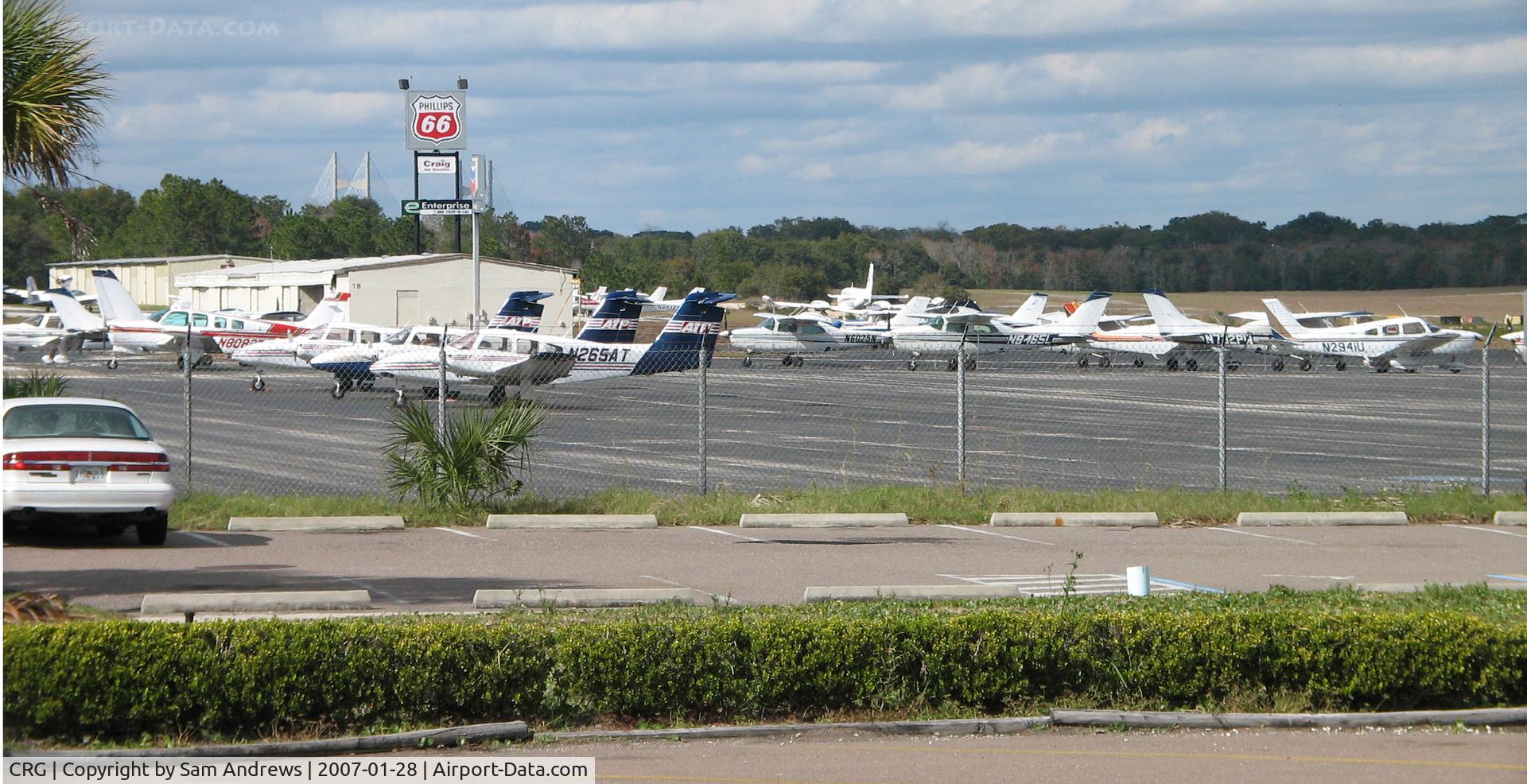 Jacksonville Executive At Craig Airport (CRG) - Sunny day in Florida.  This is the ramp behind the ATP building.  You can see the Dames River Bridge in the back ground