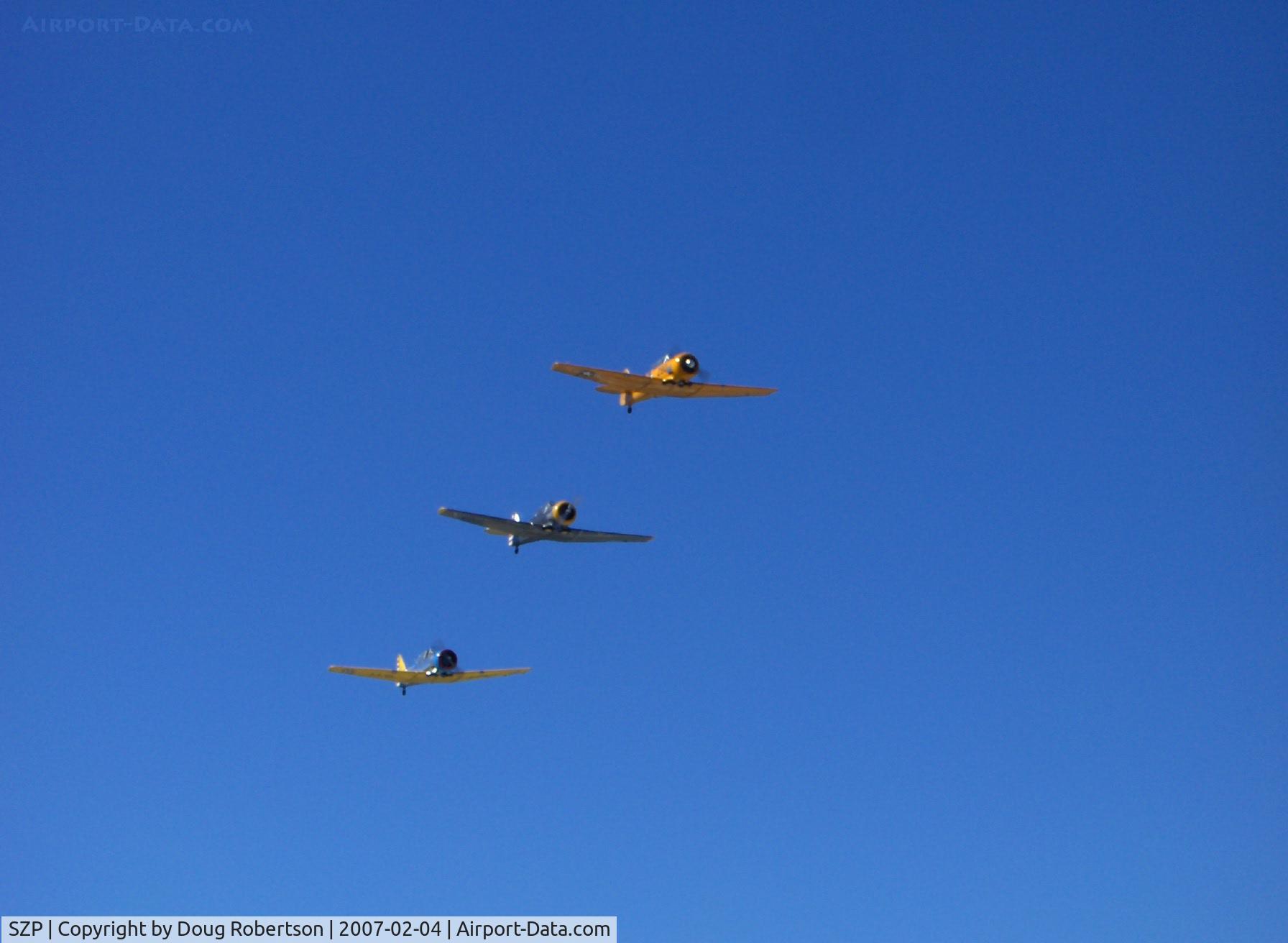 Santa Paula Airport (SZP) - N4995C T-6G 'Thirsty Girl', N8540P AT-6D 'Miss Universe', N89014 SNJ-5 echelon flyover at speed Runway 04 (very nice on the photographer's birthday!)