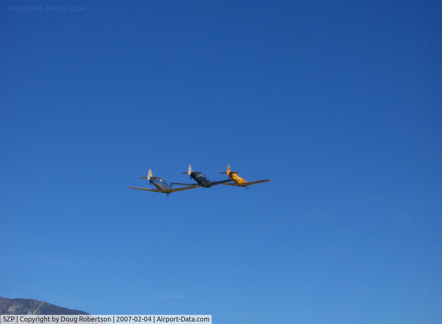 Santa Paula Airport (SZP) - N4995C T-6G 'Thirsty Girl', N8540P AT-6D 'Miss Universe', N89014 SNJ-5 echelon flyover at speed Runway 04 (very nice on the photographer's birthday!)