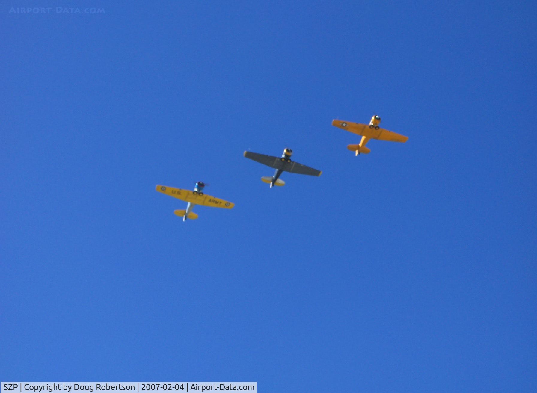 Santa Paula Airport (SZP) - N4995C T-6G 'Thirsty Girl', N8540P AT-6D 'Miss Universe', N89014 SNJ-5 echelon flyover at speed Runway 04 (very nice on the photographer's birthday!)