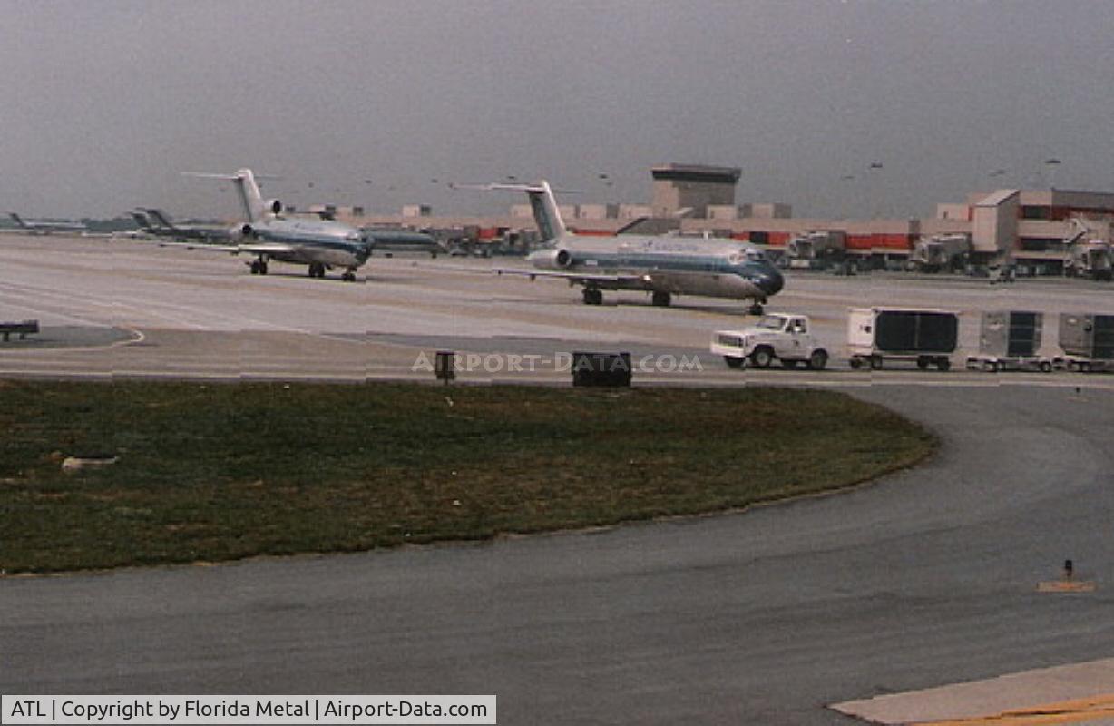 Hartsfield - Jackson Atlanta International Airport (ATL) - Planes line up at Atlanta in 1986