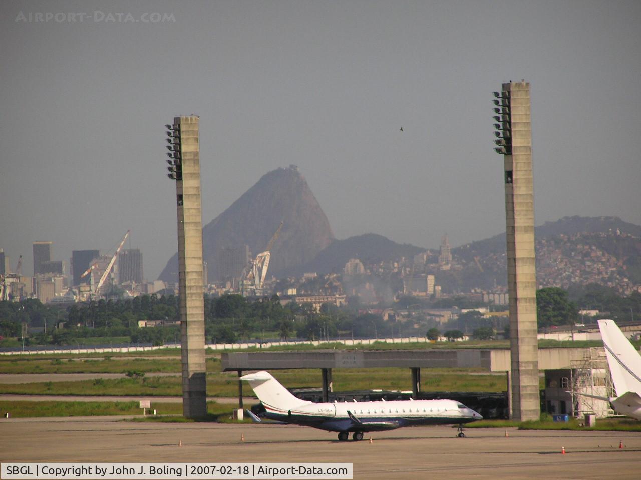 Galeão Airport, Antônio Carlos Jobim International Airport Brazil (SBGL) - Biz jet on ramp at Rio. Sugar Loaf Mountian in background.