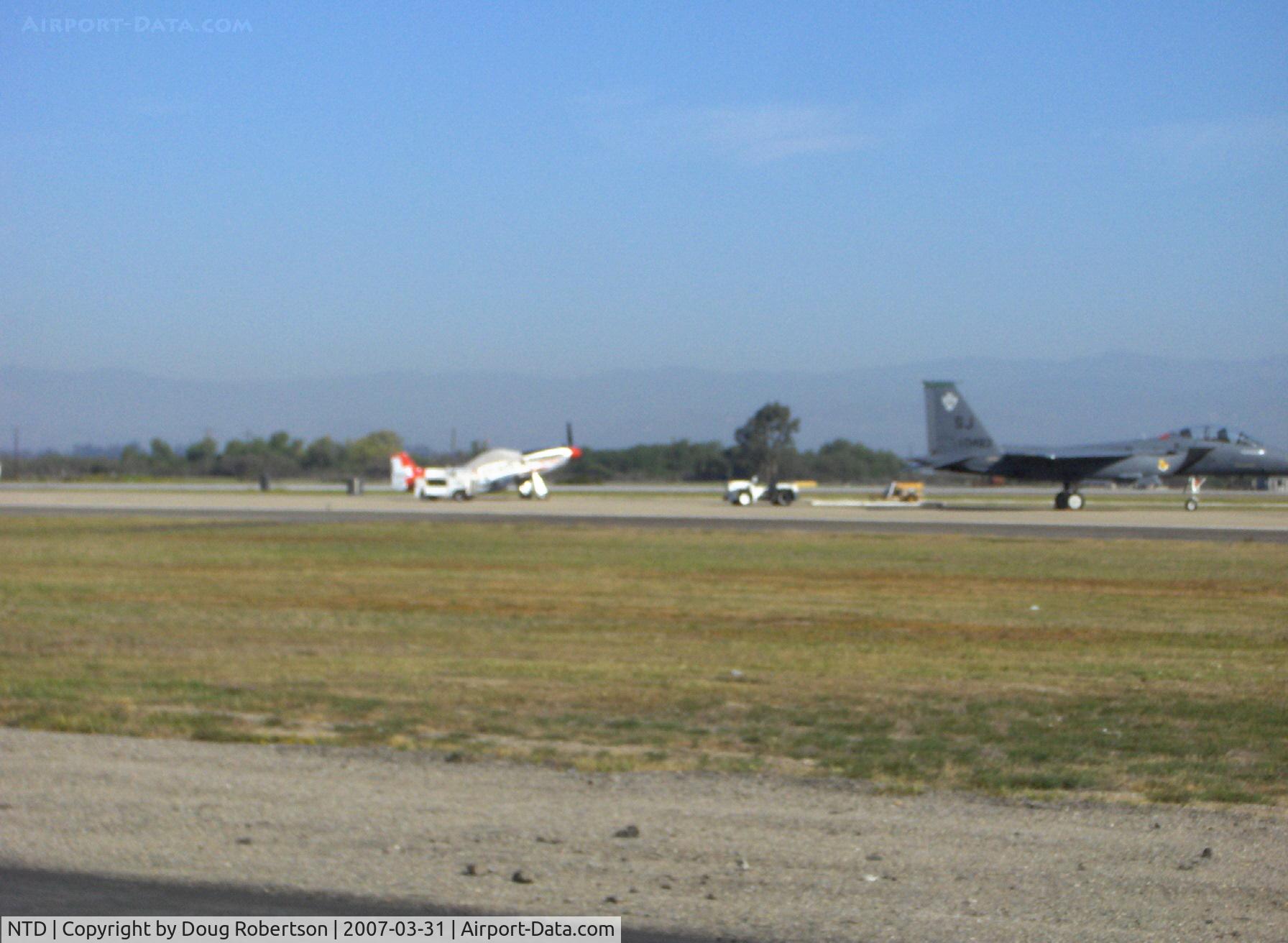 Point Mugu Nas (naval Base Ventura Co) Airport (NTD) - Two of the commemorative Heritage Flight fighters: WWII North American P-51D MUSTANG and current McDonnell Douglas F-15E STRIKE EAGLE
