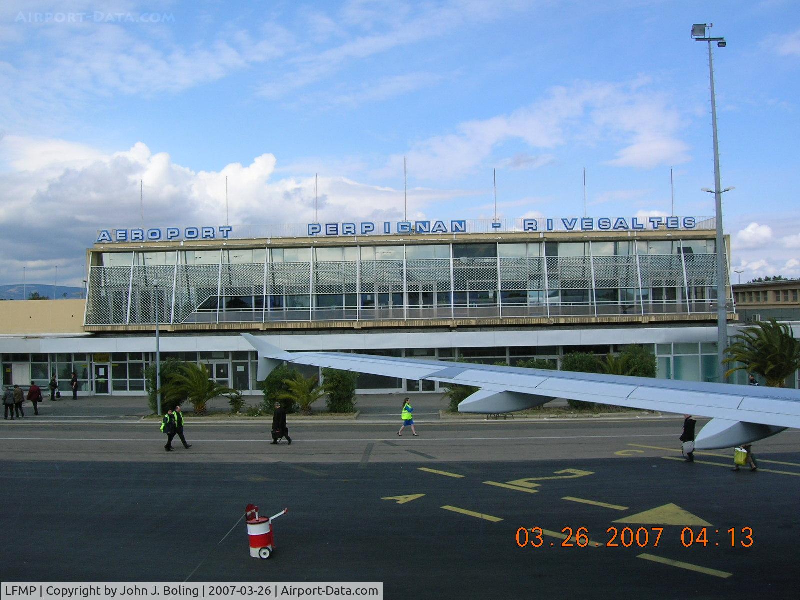 Perpignan Rivesaltes Airport, Perpignan France (LFMP) - Terminal at Perpignan, France. No jet bridge. Stairs and walk across the ramp - rain or shine