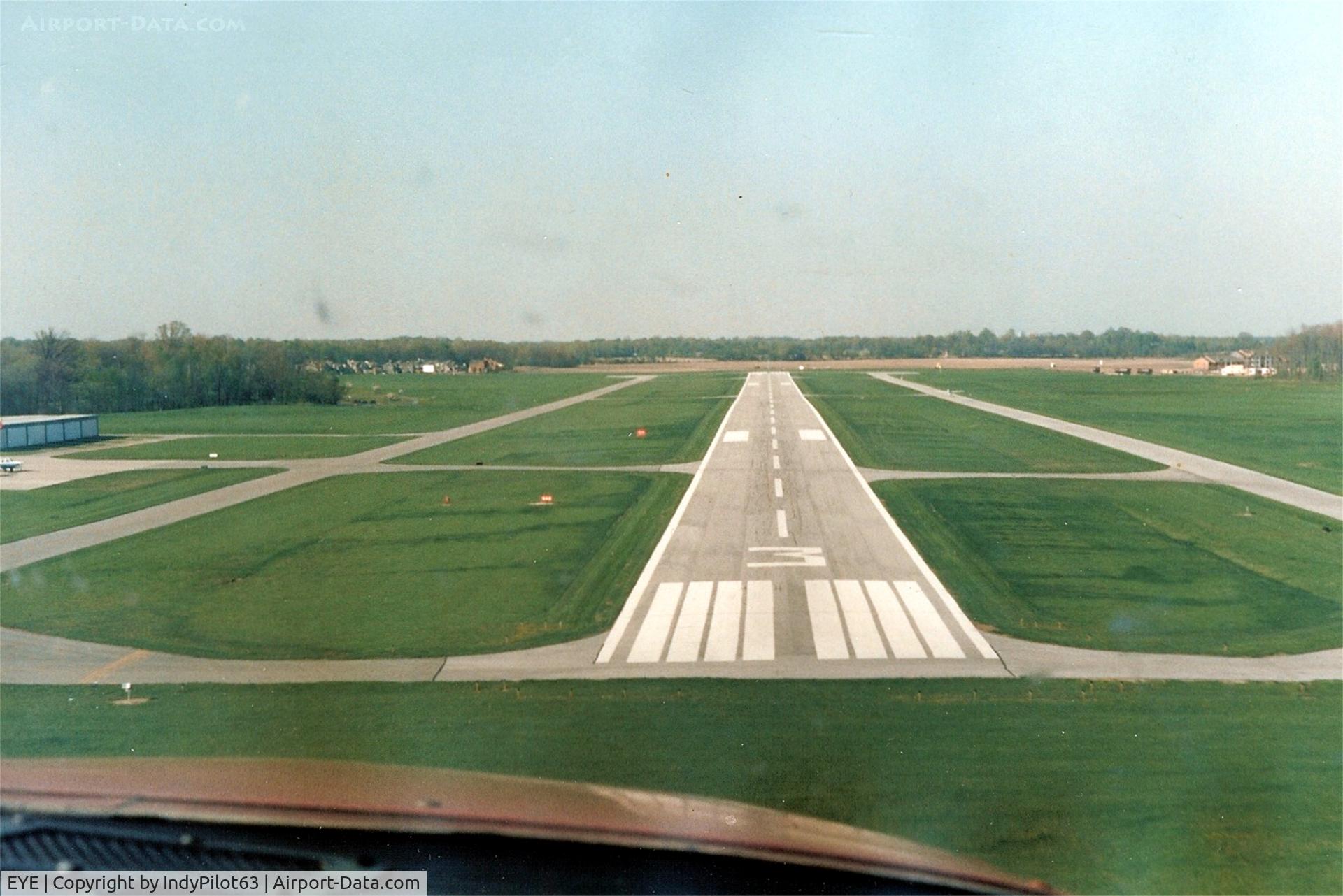 Eagle Creek Airpark Airport (EYE) - Landing on 03 back around 1990 in an orange Cessna Cardinal.