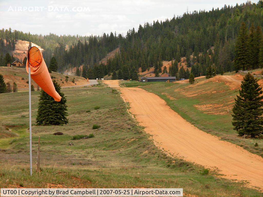 Swains Creek Airport (UT00) - Not much of an airport here - a windsock and a very uneven runway. There are some sort of buildings at the far end but no lighting that I can see - good luck landing!