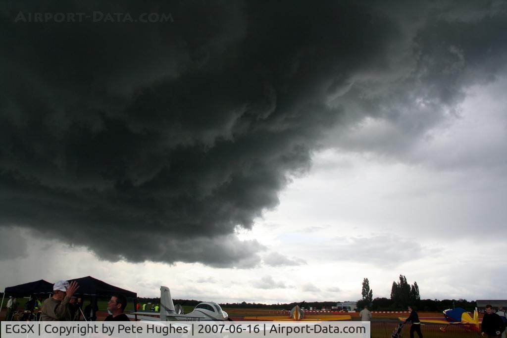 North Weald Airfield Airport, North Weald, England United Kingdom (EGSX) - stormclouds overhead North Weald at Air-Britain's 2007 Fly-In just before tents blew away and the downpour started!