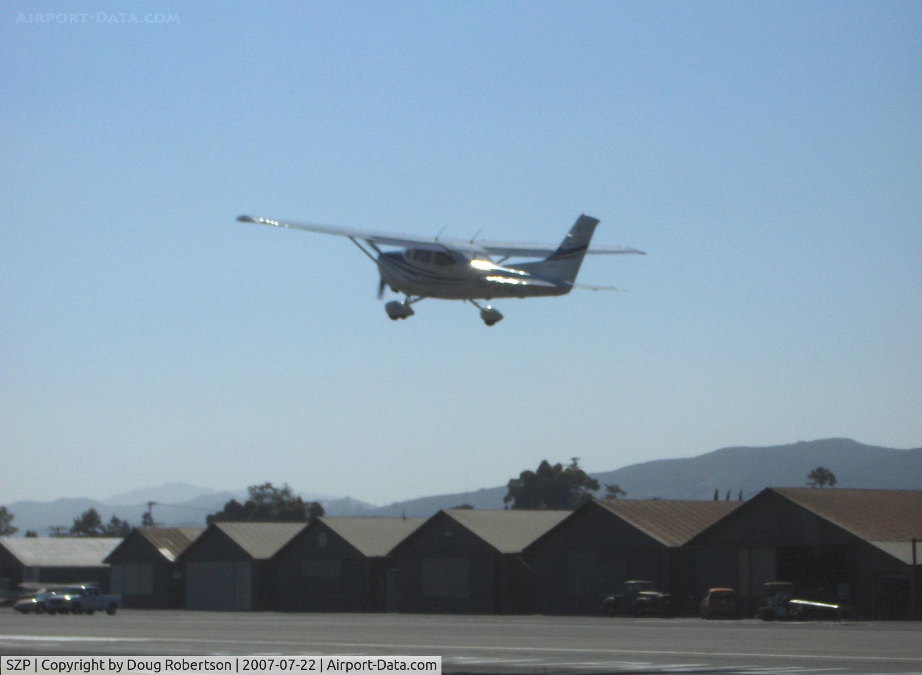 Santa Paula Airport (SZP) - A recent Cessna 172S SKYHAWK SP departs Rwy 22 into the sun