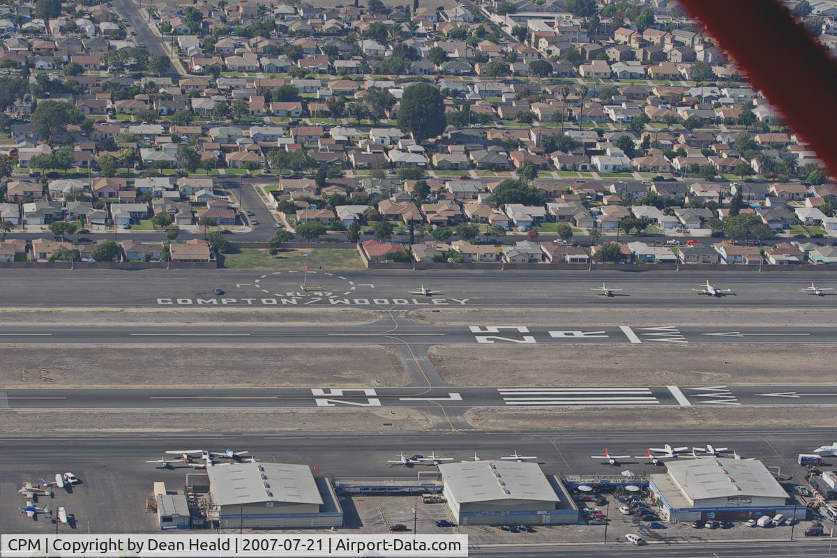 Compton/woodley Airport (CPM) - Downwind abeam the numbers for landing on RWY 25L in a 1946 Aeronca Champ (NC1659E).