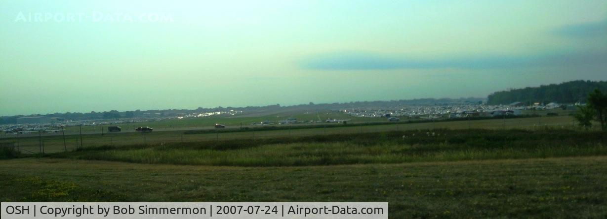 Wittman Regional Airport (OSH) - Looking east down RWY 9 at hundreds of planes on each side.