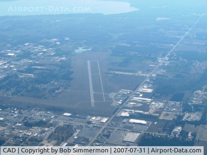 Wexford County Airport (CAD) - Looking down RWY 25.  The lake is a good landmark, but pay attention to the towers up to 3000' all around within a 10nm radius of CAD.