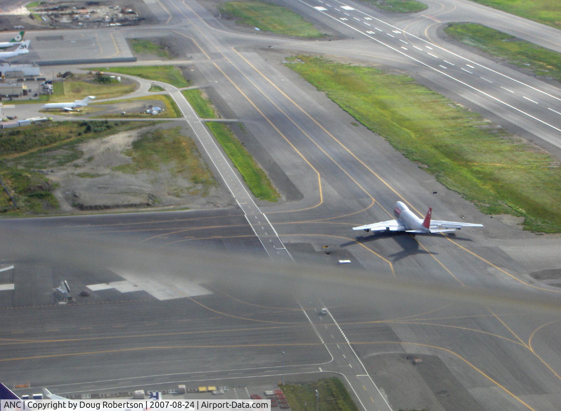 Ted Stevens Anchorage International Airport (ANC) - Boeing B747 cargo jet on taxiway. Taken from DHC-2 Beaver float plane N4444Z enroute to adjacent Lake Hood Sea Plane Base LHD. Blur across photo is copilot's window down edge.