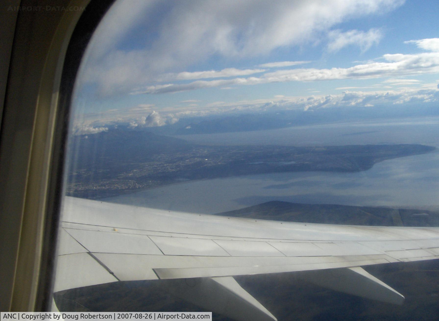 Ted Stevens Anchorage International Airport (ANC) - Airport adjacent Cook Inlet, Point Woronzof of Knik Arm. Taken from Alaska Airlines B737-700 climbing turn to altitude
