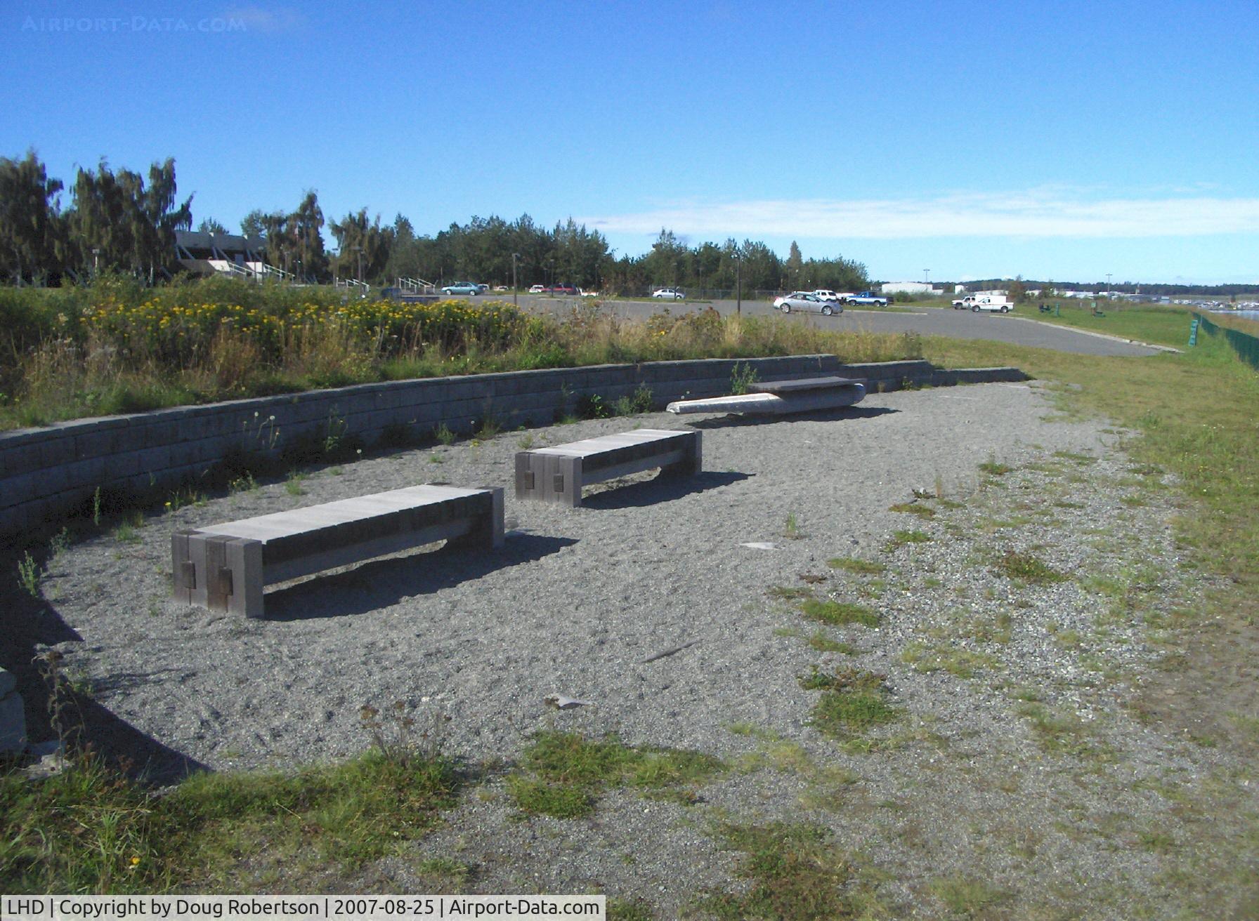 Lake Hood Seaplane Base (LHD) - Photographer's viewing area adjacent E-W 4,540' X 188' fresh water takeoff/landing lane; benches including pontoon float bench are memorials to deceased aviators