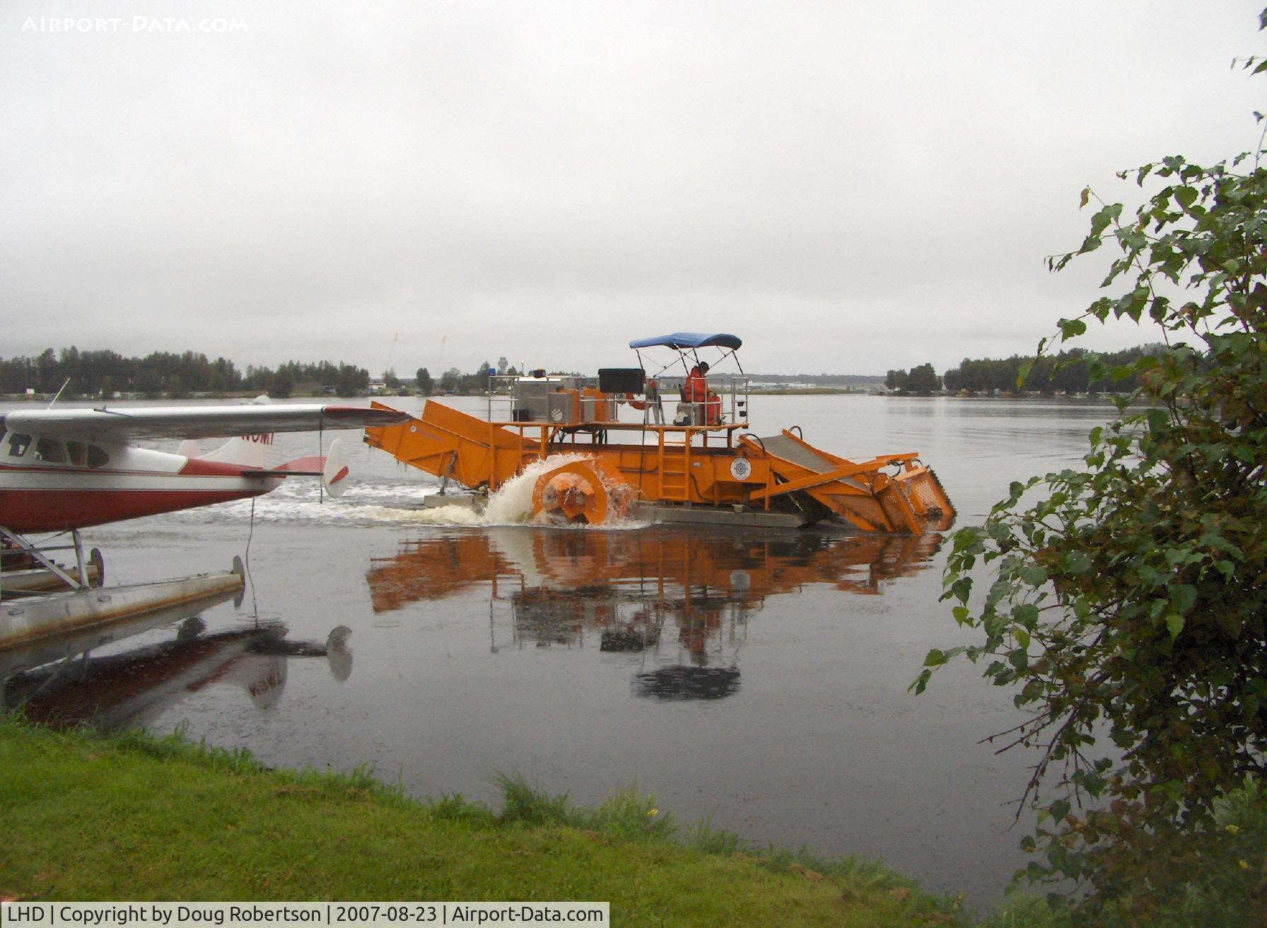 Lake Hood Seaplane Base (LHD) - Lake Hood SPB's water weed cutter/scooper at work keeping clear taxi lanes