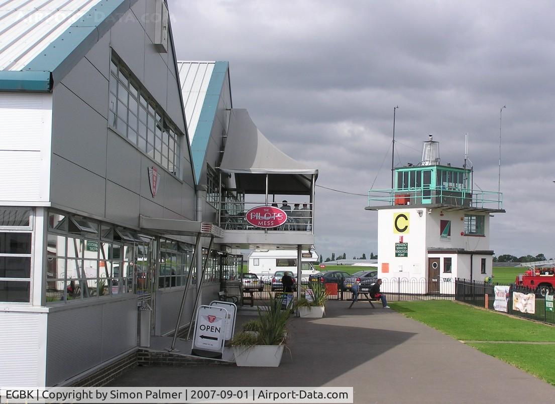 Sywell Aerodrome Airport, Northampton, England United Kingdom (EGBK) - View towards Tower past hangars at Sywell