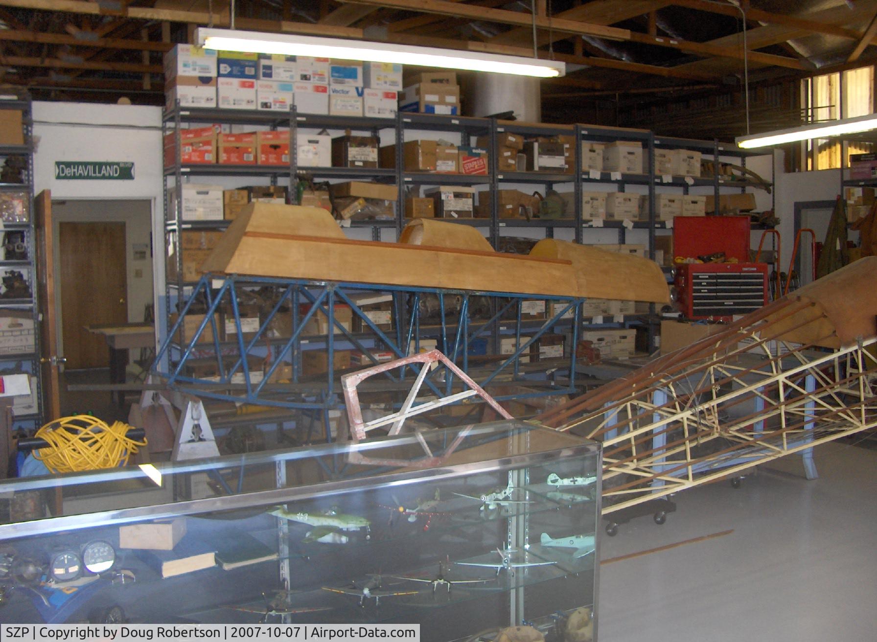 Santa Paula Airport (SZP) - DeHavilland Gipsy Moth and Tiger Moth parts in David Watson Museum Hangar