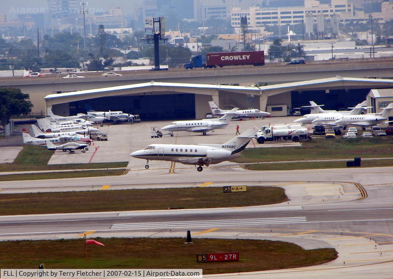 Fort Lauderdale/hollywood International Airport (FLL) - The landing aircraft passes an already busy FBO at FLL