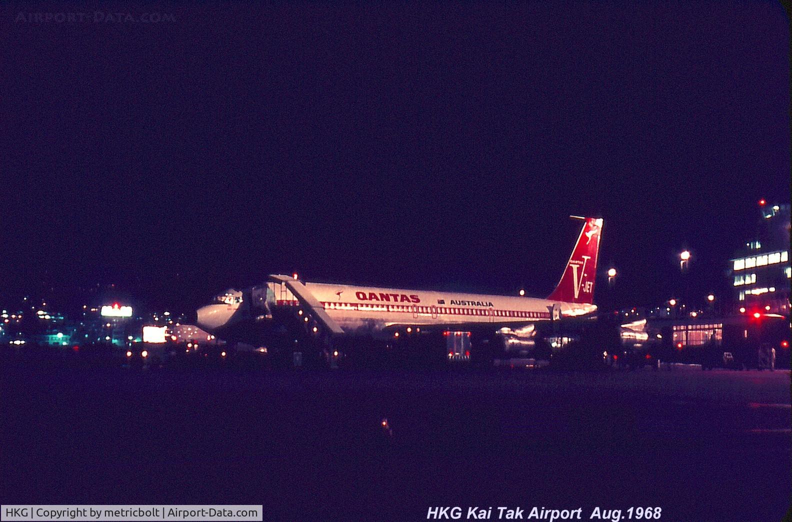 Hong Kong International Airport, Hong Kong Hong Kong (HKG) - Qantas B707 being fueled and catered in HKG Kai Tak in 1968 for late departure