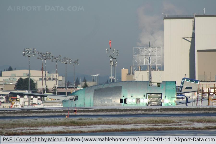 Snohomish County (paine Fld) Airport (PAE) - Unfinished 777 nose waiting in front of the main Boeing plant