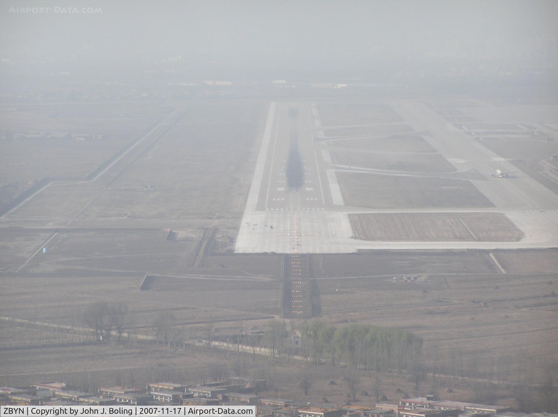 Taiyuan Wusu Airport, Taiyuan, Shanxi China (ZBYN) - Runway 31 at Taiyuan PRC, ZBYN/TYN. Haze/smog keeps vis low.