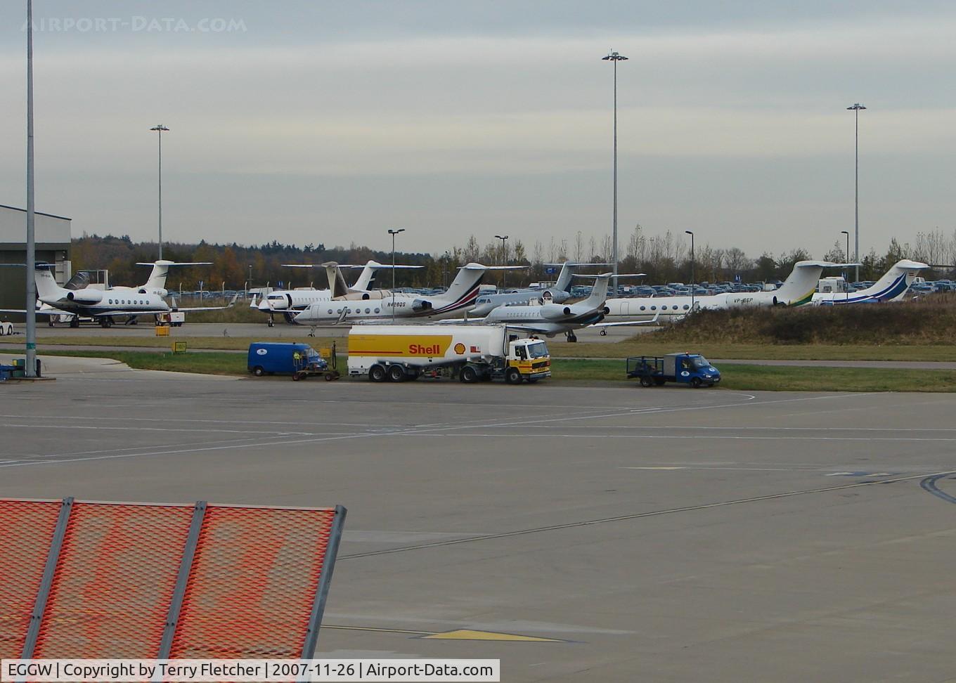 London Luton Airport, London, England United Kingdom (EGGW) - A general view over the parking stands outside the Harrods Aviation hangars