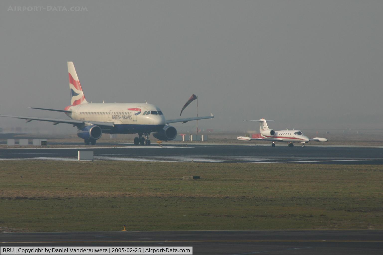 Brussels Airport, Brussels / Zaventem   Belgium (BRU) - queueing to take off  -  Learjet 35A/OO-LFV followed by A319-131/G-EUPS