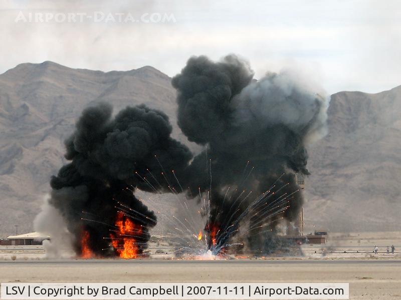 Nellis Afb Airport (LSV) - Nellis AFB ATCT with smoke and fire from mock wargames. Aviation Nation 2007