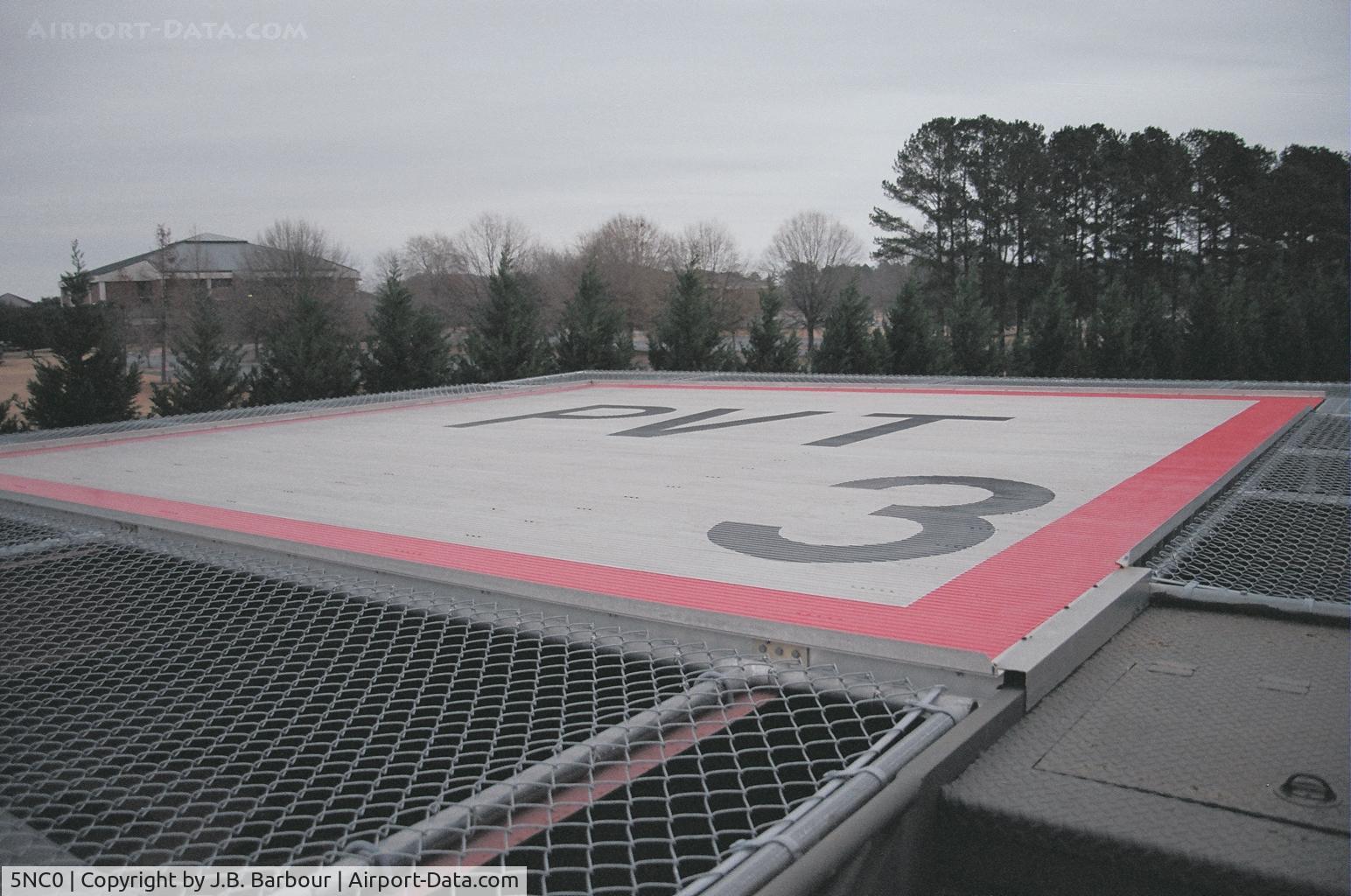 Carolina Kidney Heliport (5NC0) - You would nave to really be on the stick to set er' down here.  Wow.  Not only the height to throw you off but it shaking too!