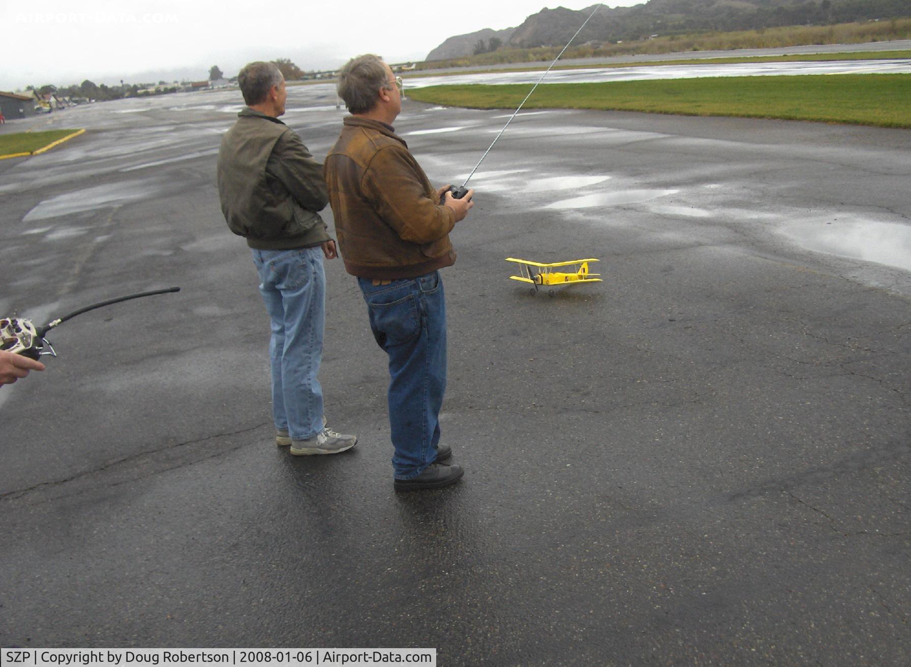 Santa Paula Airport (SZP) - RC Drone flights on a calm windless day near threshold to Rwy 04, Monoplane & Ornithopter flight controllers. Tiger Moth RC drone on deck.