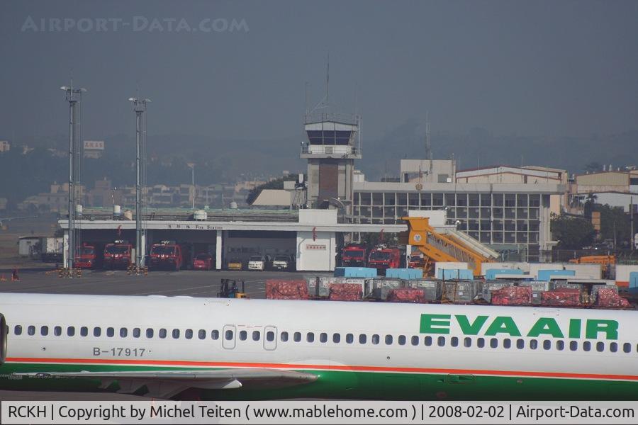 Kaohsiung International Airport, Kaohsiung City Taiwan (RCKH) - The airport firefighter building can be seen behind the MD-90 from EVA Air