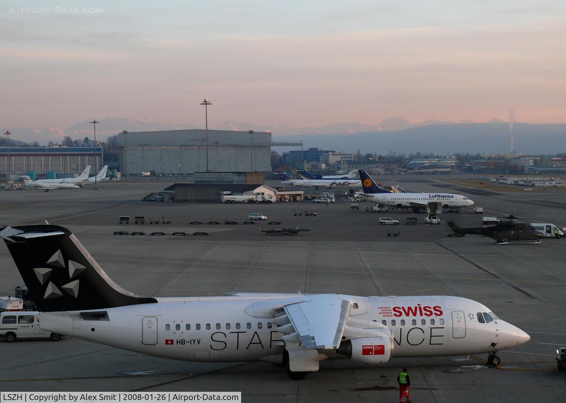 Zurich International Airport, Zurich Switzerland (LSZH) - Last light on the platform and the mountaintops in the back
