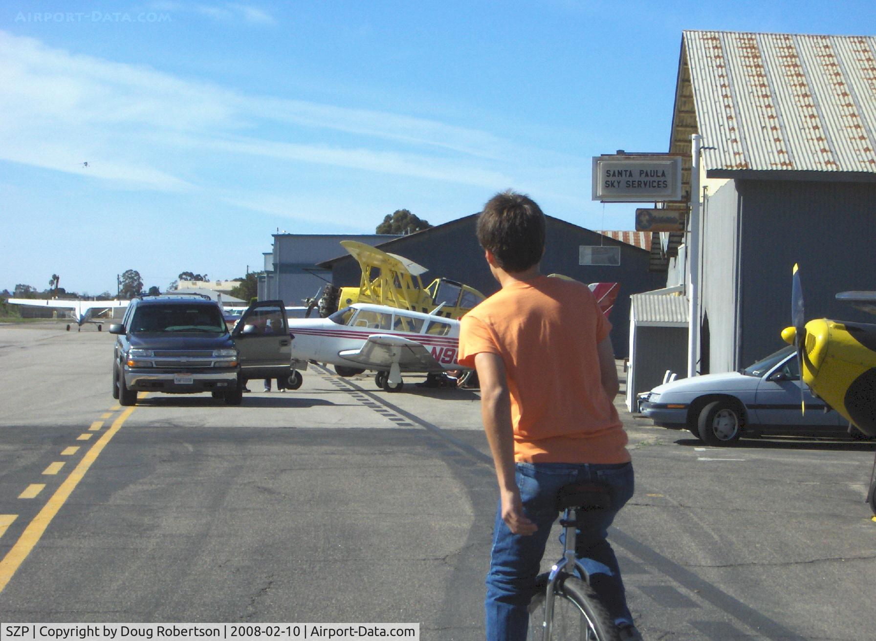 Santa Paula Airport (SZP) - Personal forms of SZP airport transportation include golf carts, motorcycles, motorscooters, bicycles, motorized bicycles and a ...UNICYCLE! Sammy Mason onboard.