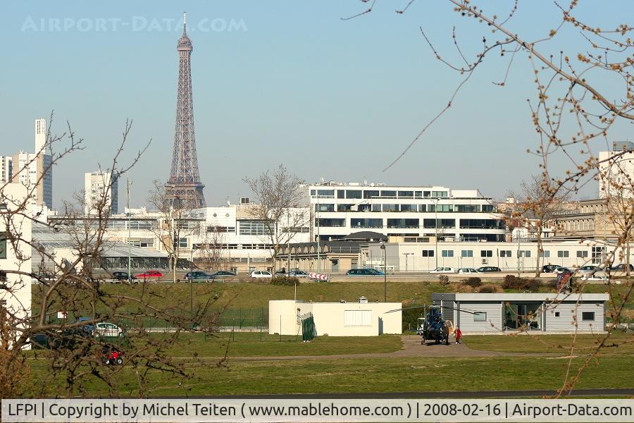 Paris Issy-les-Moulineaux Airport, Paris France (LFPI) - Heliport Paris-Issy with the Eiffel Tower in the background
