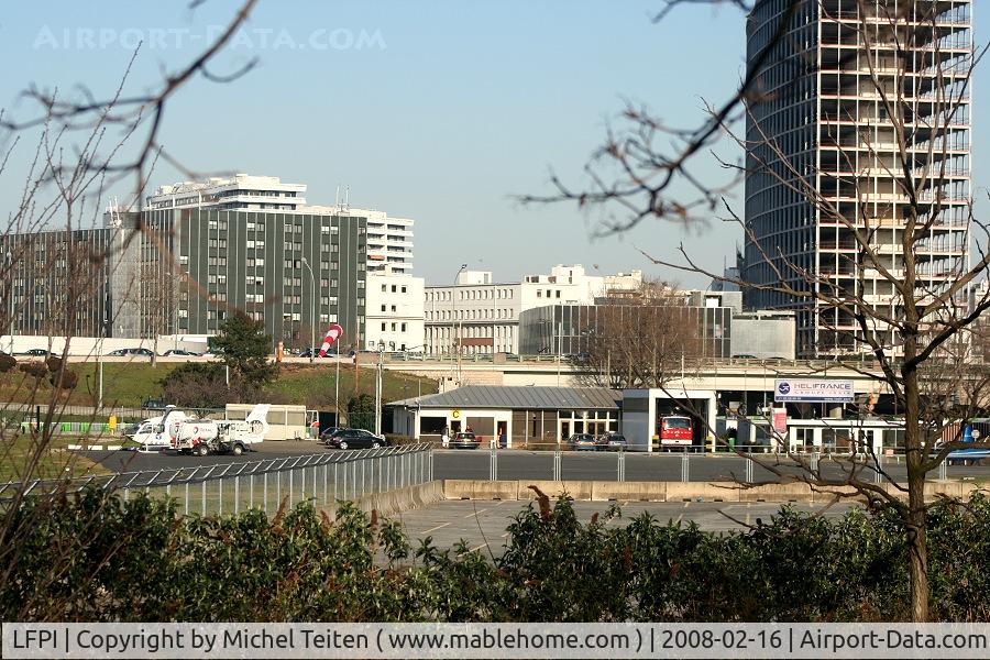 Paris Issy-les-Moulineaux Airport, Paris France (LFPI) - Heliport Paris-Issy - The headquarter of the French Air Force is in the buildings in the background