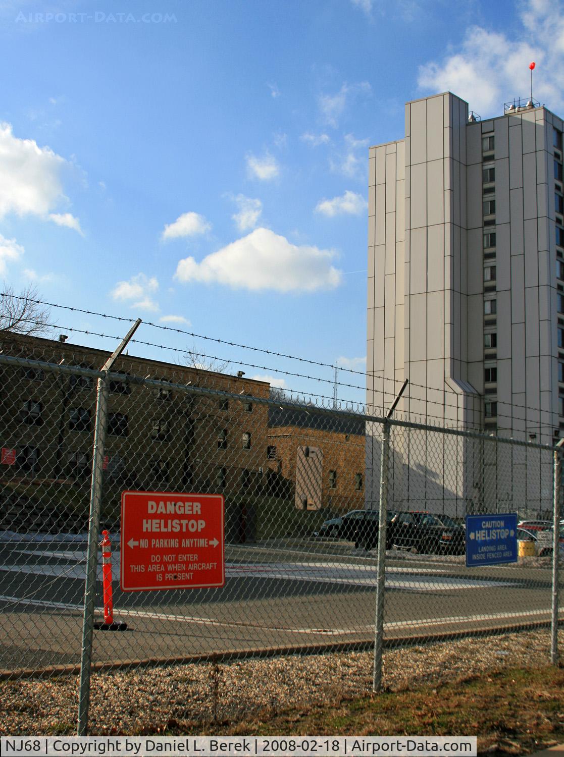 NJ68 Airport - This heliport serves the St. Joseph's Trauma Center, Paterson, NJ.  The heliport may be relocated if an expansion project goes through.  I snapped this picture just before a priest tried to chase me away; I may end up in a dark, hot, dreary place....