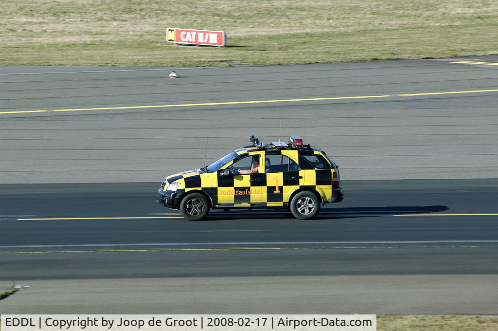 Düsseldorf International Airport, Düsseldorf Germany (EDDL) - Local control vehicle on its wa to the end of the runway