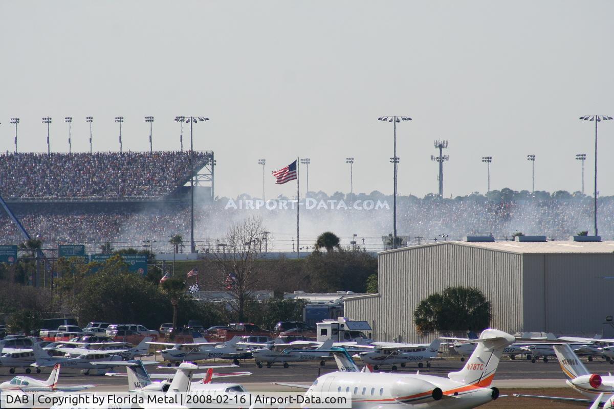 Daytona Beach International Airport (DAB) - Smoke from a crash on the track during Busch Race in background
