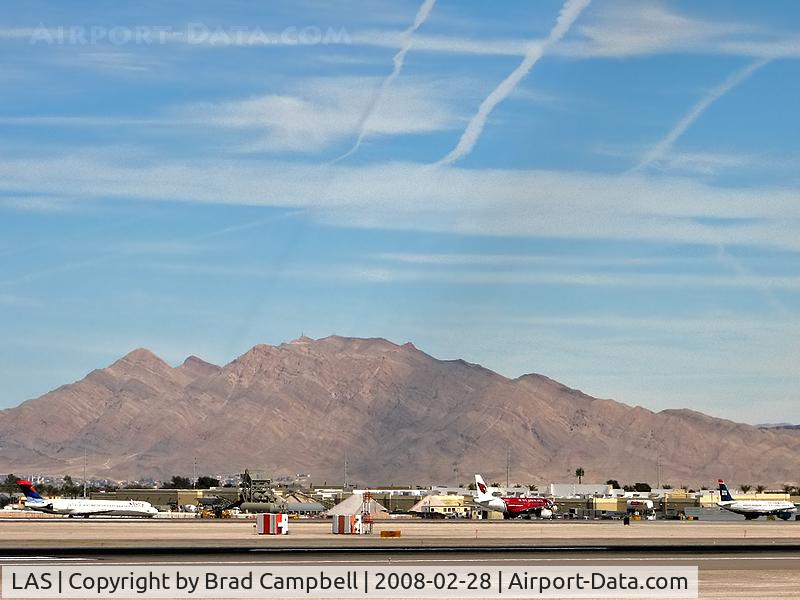 Harry Reid International Airport (LAS) - Bizarre Shadows being cast. They're from Contrails.